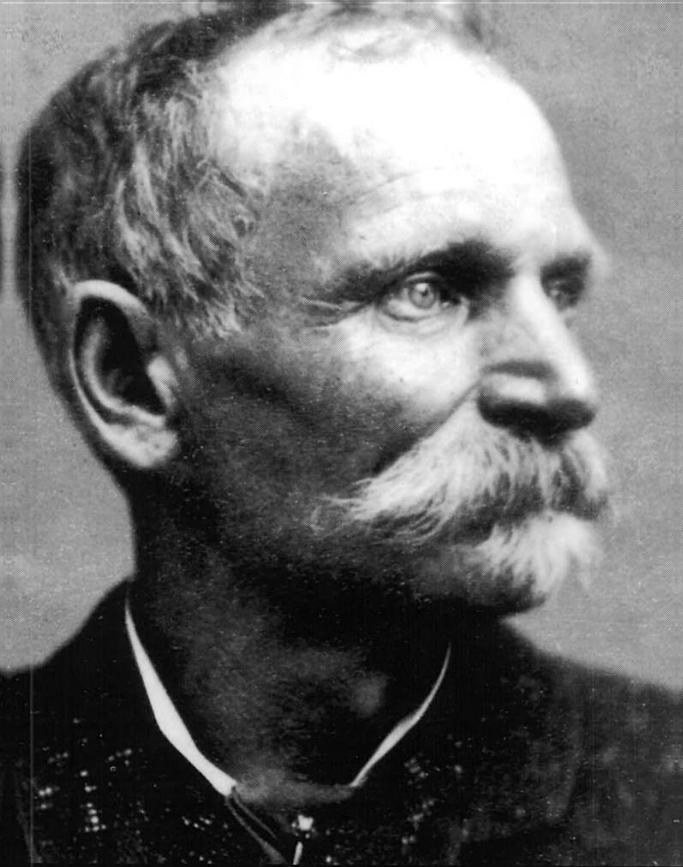 Black-and-white portrait photograph of Charles Boles, alias Black Bart, an older man with a full mustache shown in profile